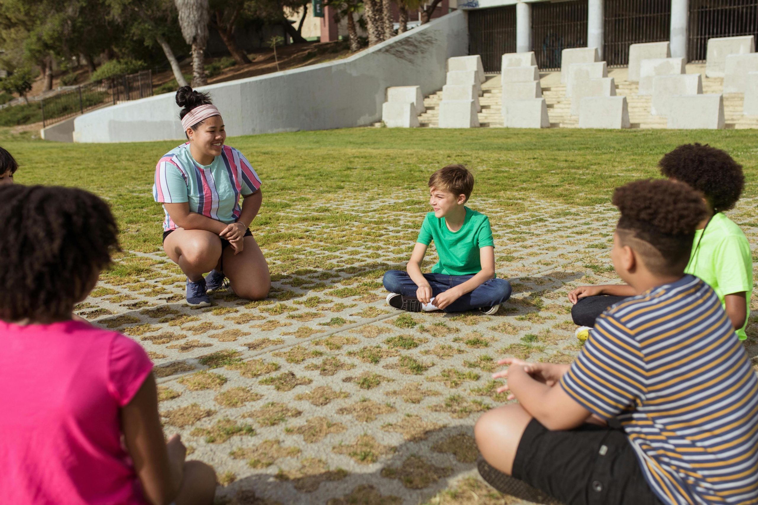 Camp counsellor leader with group in summer Camp America 