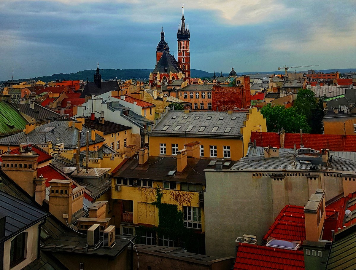 Assorted coloured buildings with a blue sky in Kraków, Poland
