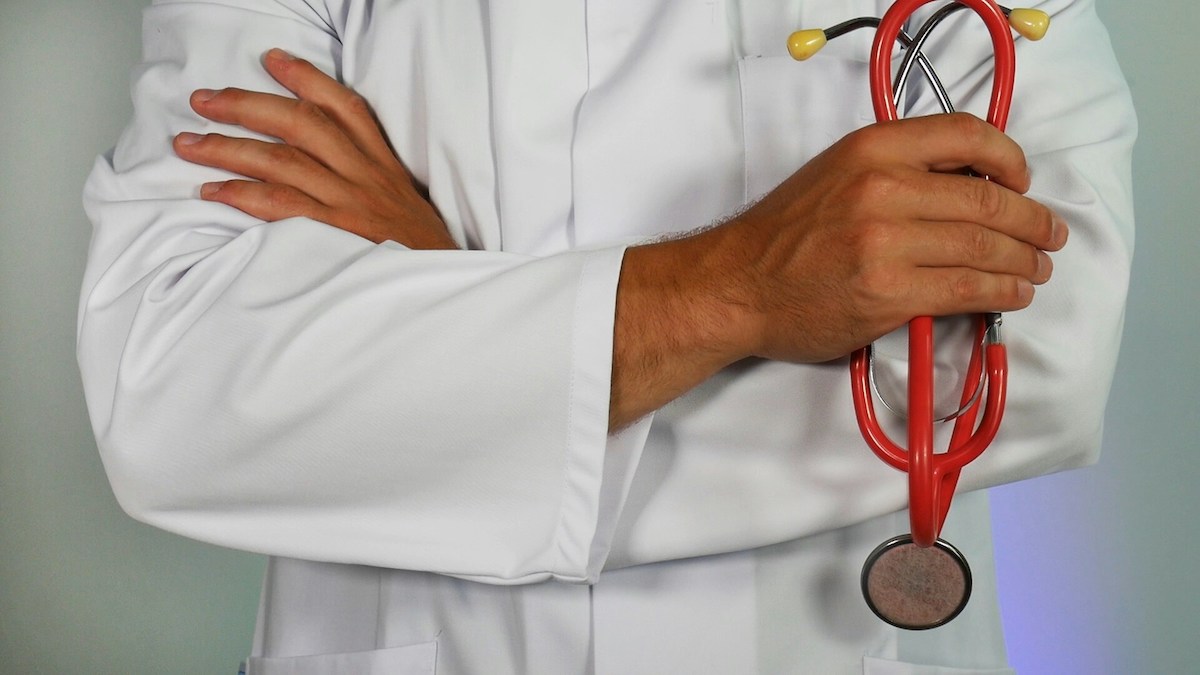 Doctor holding a red stethescope