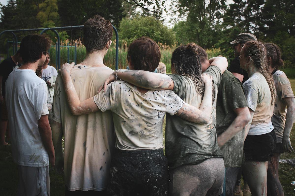 Group of muddy kids