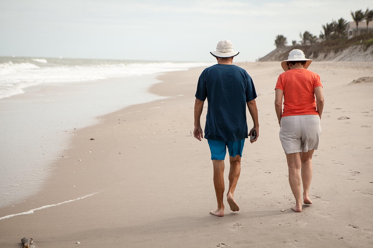 Retired couple walking on a beach