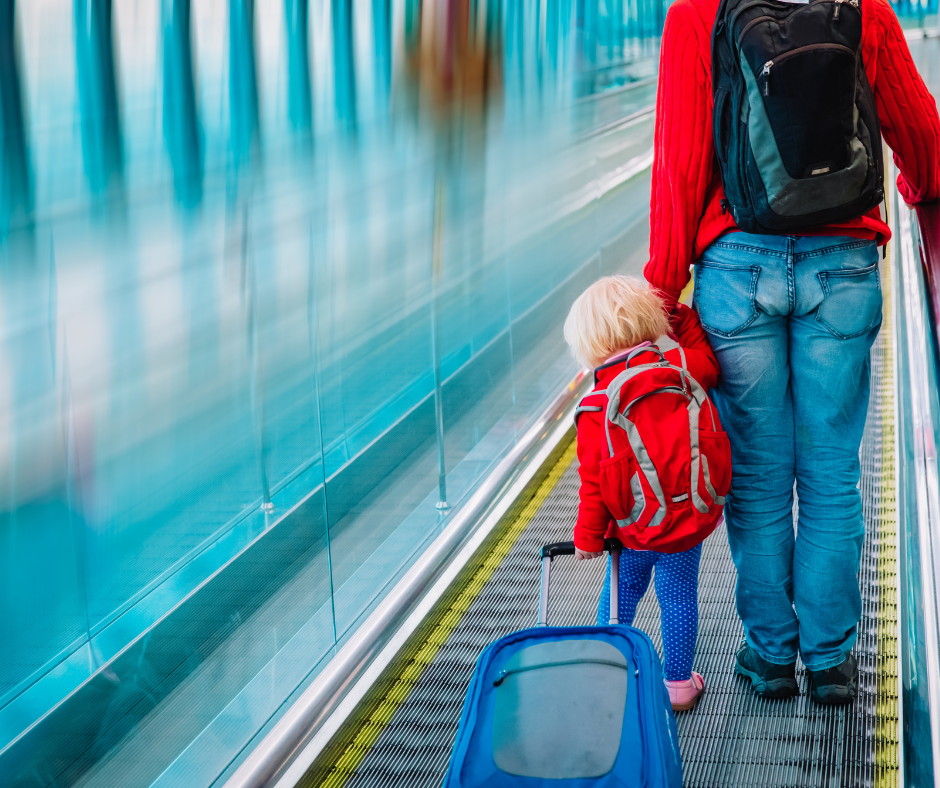 father and little daughter on travalator in airport, family travel